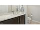 Bathroom boasts a modern vanity with light countertops and a neutral color palette at 9690 Hiking Ave, Las Vegas, NV 89166