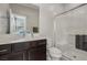 Bathroom features a sleek vanity with dark wood cabinetry and a glass enclosed shower at 9690 Hiking Ave, Las Vegas, NV 89166