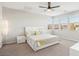 Bright, airy bedroom with a large window, ceiling fan, and modern furniture at 9690 Hiking Ave, Las Vegas, NV 89166