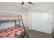 This bedroom features a bunk bed, closet, and ceiling fan at 9690 Hiking Ave, Las Vegas, NV 89166