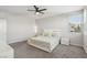 A bright, spacious bedroom featuring natural light from its large windows and simple decor at 9690 Hiking Ave, Las Vegas, NV 89166