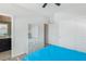 Primary bedroom features plush carpet, white trim and access to a large en suite bathroom at 9690 Hiking Ave, Las Vegas, NV 89166