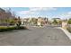 Gated community entrance featuring a gate, landscaping, and a paved entry at 9690 Hiking Ave, Las Vegas, NV 89166