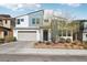 Stylish two-story home featuring a modern design, two-car garage, and well-maintained landscaping at 9690 Hiking Ave, Las Vegas, NV 89166