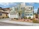 Striking two-story house with a modern design, two-car garage, and desert-friendly yard at 9690 Hiking Ave, Las Vegas, NV 89166