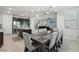 Open concept kitchen and dining area with modern appliances and contemporary decor at 9690 Hiking Ave, Las Vegas, NV 89166