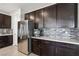 Bright kitchen showcasing stainless steel appliances, granite counters, and a stylish backsplash at 9690 Hiking Ave, Las Vegas, NV 89166