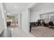 Bright living room featuring tile entry, neutral carpet and grey walls at 9690 Hiking Ave, Las Vegas, NV 89166