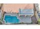 Aerial view of the backyard featuring a private pool, covered patio, and landscaped yard at 9741 Panorama Cliff Dr, Las Vegas, NV 89134