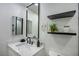 Bathroom with stylish vanity, framed mirror and modern fixtures at 9741 Panorama Cliff Dr, Las Vegas, NV 89134