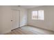 Bedroom with new laminate flooring, fresh white paint, and a closet with bi-fold doors at 9741 Panorama Cliff Dr, Las Vegas, NV 89134