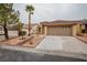 Well-maintained single-story home with desert landscaping and a two-car garage at 9741 Panorama Cliff Dr, Las Vegas, NV 89134