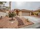 Charming single-story home with a low-maintenance desert landscape and a two-car garage at 9741 Panorama Cliff Dr, Las Vegas, NV 89134