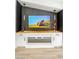Living room with custom entertainment center with built in fireplace and storage space at 9741 Panorama Cliff Dr, Las Vegas, NV 89134
