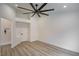 Bright main bedroom with high ceilings, fan, and ensuite bathroom with frameless shower at 9741 Panorama Cliff Dr, Las Vegas, NV 89134