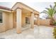 View of the covered patio with desert landscaping and access to the home's interior at 9741 Panorama Cliff Dr, Las Vegas, NV 89134