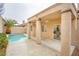 Inviting pool area with a covered patio, perfect for outdoor relaxation and entertaining at 9741 Panorama Cliff Dr, Las Vegas, NV 89134
