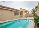 A view of the backyard pool with covered patio, perfect for outdoor enjoyment at 9741 Panorama Cliff Dr, Las Vegas, NV 89134