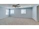 Spacious bedroom features include gray carpet, ceiling fan, and window for great natural light at 981 Soaring Moon Dr, Henderson, NV 89015