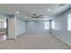 Large bedroom with gray carpet, ceiling fan, recessed lights, and multiple windows for light at 981 Soaring Moon Dr, Henderson, NV 89015