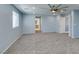 Bright bedroom has gray carpet, ceiling fan, recessed lights, and easy access to en-suite bathroom at 981 Soaring Moon Dr, Henderson, NV 89015