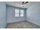 Cozy bedroom featuring a ceiling fan, plush carpet, and abundant natural light at 981 Soaring Moon Dr, Henderson, NV 89015