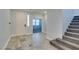 Bright entryway with beautiful tile, a staircase, and an inviting, open atmosphere at 981 Soaring Moon Dr, Henderson, NV 89015