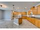 A spacious kitchen featuring a granite countertop island, and stainless steel appliances at 981 Soaring Moon Dr, Henderson, NV 89015