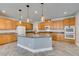 Kitchen with a central island, stainless steel appliances, and ample cabinet space at 981 Soaring Moon Dr, Henderson, NV 89015