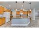 View of the kitchen island, appliances, cabinets, and granite countertop at 981 Soaring Moon Dr, Henderson, NV 89015