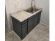 Bright laundry room offers a utility sink, granite countertops and a window for natural light at 981 Soaring Moon Dr, Henderson, NV 89015