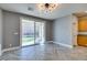 Open living room featuring tile floors, large sliding glass doors, and neutral paint at 981 Soaring Moon Dr, Henderson, NV 89015