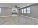 Comfortable living room boasts sleek floors, a modern fireplace and plenty of sunlight at 981 Soaring Moon Dr, Henderson, NV 89015