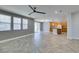 Open living room showcasing the kitchen, wood floors, and sliding glass doors at 981 Soaring Moon Dr, Henderson, NV 89015