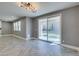 Open living room featuring tile floors, large sliding glass doors, and neutral paint at 981 Soaring Moon Dr, Henderson, NV 89015