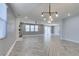 Bright and open living room featuring sleek floors and modern lighting fixtures at 981 Soaring Moon Dr, Henderson, NV 89015