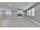 Modern living space showcases fireplace, lots of natural light and sleek tile flooring at 981 Soaring Moon Dr, Henderson, NV 89015