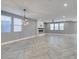 Spacious living area with modern fireplace, wood-style floors, and abundant natural light at 981 Soaring Moon Dr, Henderson, NV 89015