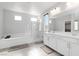 Spacious bathroom with tub, walk-in shower and double sink vanity at 11548 Salt Creek Ave, Las Vegas, NV 89138