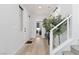 Bright foyer with hardwood flooring, a staircase, and contemporary lighting fixtures creates a welcoming ambiance at 11548 Salt Creek Ave, Las Vegas, NV 89138