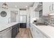 Modern kitchen with stainless steel appliances, a breakfast bar, and stylish backsplash at 11548 Salt Creek Ave, Las Vegas, NV 89138