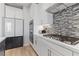 Well-appointed kitchen features stainless appliances, sleek cabinetry, and stone countertops at 11548 Salt Creek Ave, Las Vegas, NV 89138