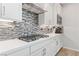 Bright, updated kitchen with quartz counters, custom backsplash, and stainless steel appliances at 11548 Salt Creek Ave, Las Vegas, NV 89138
