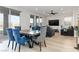 Open-concept living room with modern furnishings and plenty of natural light from the windows at 11548 Salt Creek Ave, Las Vegas, NV 89138