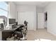 Bright office space featuring a modern desk and chair with large closet for storage at 11548 Salt Creek Ave, Las Vegas, NV 89138