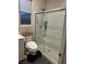 Bathroom with a glass-enclosed shower with a shower head and modern toilet at 12451 Island Bells Ave, Las Vegas, NV 89138