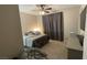 Bedroom with neutral walls, ceiling fan, carpet, and a comfortable-looking bed at 12451 Island Bells Ave, Las Vegas, NV 89138