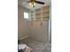 Bedroom displaying a built-in Murphy bed and storage shelves with carpet and ceiling fan at 12451 Island Bells Ave, Las Vegas, NV 89138