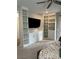Bedroom boasting built-in storage including shelves, drawers and cabinets, along with a flat-screen television at 12451 Island Bells Ave, Las Vegas, NV 89138