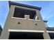 Modern home exterior showcasing a private balcony and architectural detailing at 12451 Island Bells Ave, Las Vegas, NV 89138